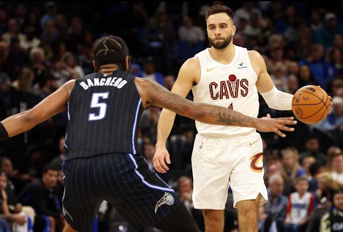 Jan 22, 2024; Orlando, Florida, USA; Cleveland Cavaliers guard Max Strus (1) dribbles as Orlando Magic forward Paolo Banchero (5) defends during the second quarter at Kia Center.